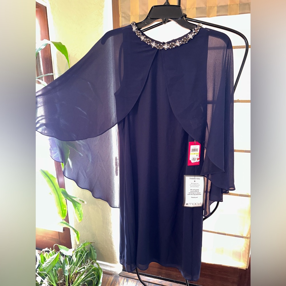 Vince Camuto navy dress from Macys with tags never worn. It is a size 4.